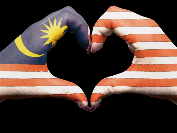 Heart and love gesture by hands colored in malaysia flag for tou — Stock Photo, Image