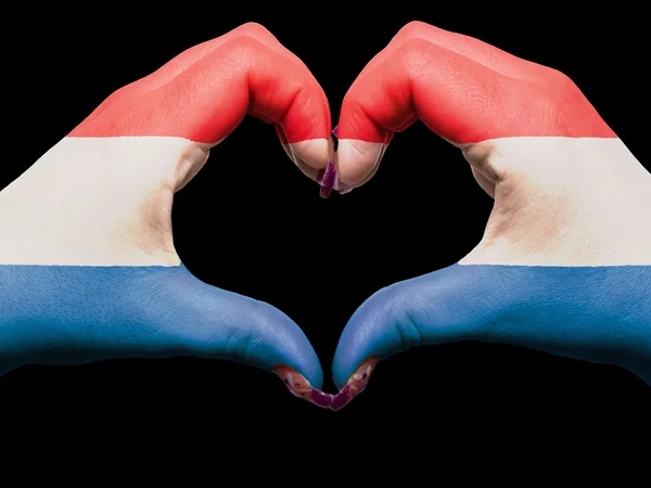 Corazón y gesto de amor por las manos coloreadas en la bandera de los Países Bajos para —  Fotos de Stock