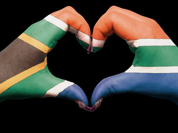 Coração e amor gesto por mãos coloridas na bandeira da áfrica do sul para — Fotografia de Stock