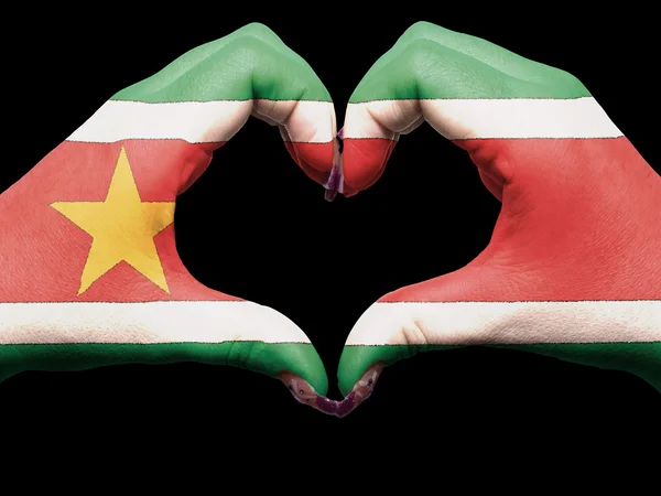Heart and love gesture by hands colored in suriname flag for tou — Stock Photo, Image