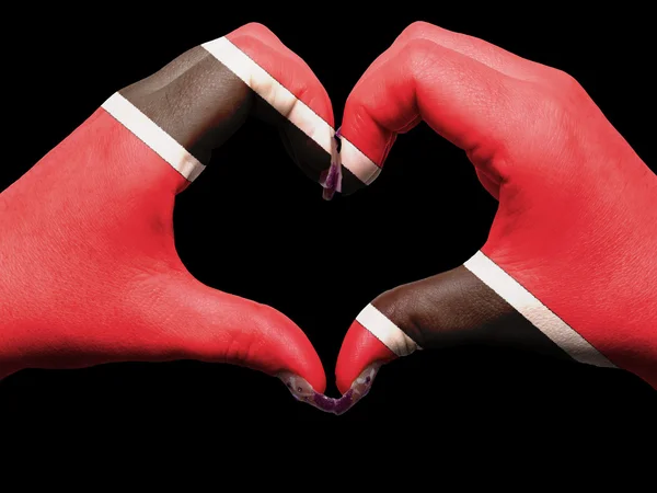 Hjärta och kärlek gest av händer färgade i trinidad tobago flagga — Stockfoto