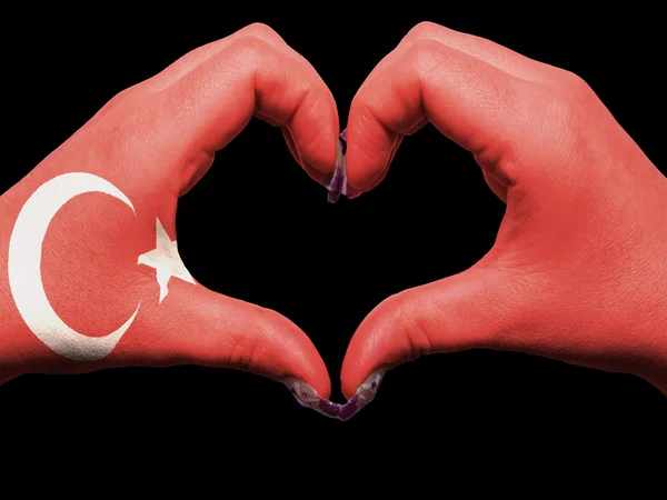 在火炭期间在土耳其国旗色的心和爱的姿态的手 — 图库照片