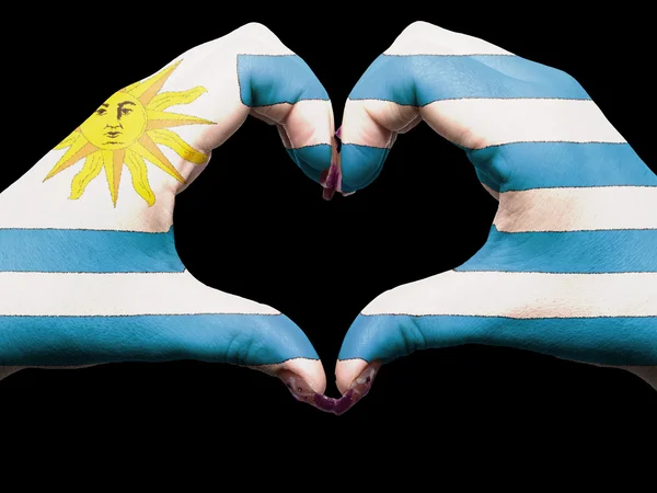 Жест любви и сердца руками, раскрашенными в уругвайский флаг для тура — стоковое фото