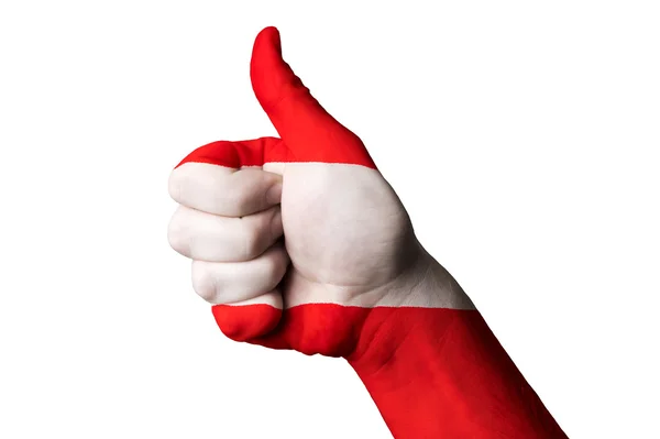 Österrike flagga tummen upp gest för excellence och UNI — Stockfoto