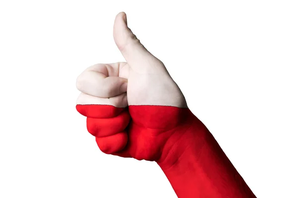 Національний прапор Польщі великий палець вгору жестом за видатні досягнення і досягнення — стокове фото