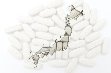 Japonya sağlık için arka planda hapları ile anahat Haritası ve