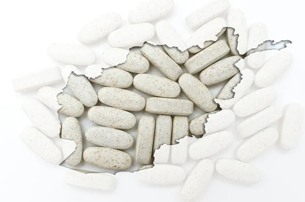 Skitse kort over Afghanistan med piller i baggrunden for helbredelse - Stock-foto