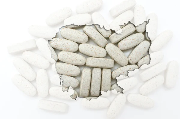 Outline map of cambodia with pills in the background for health — Stock Photo, Image