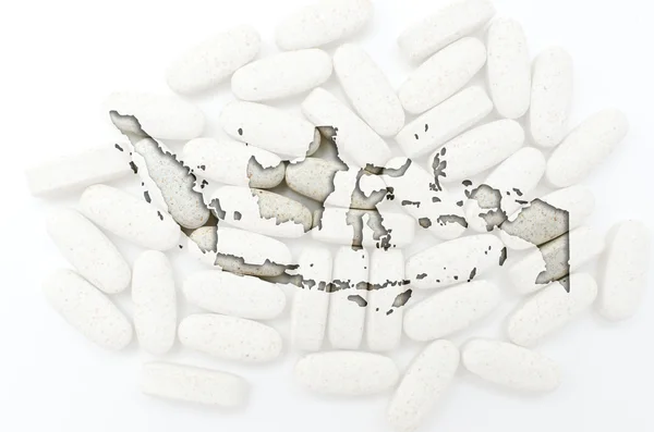 Übersichtskarte von Indonesien mit Pillen im Hintergrund für die Gesundheit — Stockfoto