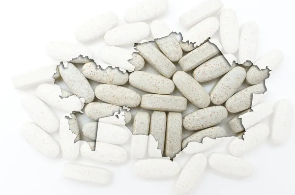 Outline map of kazakhstan with pills in the background for healt — Stock Photo, Image