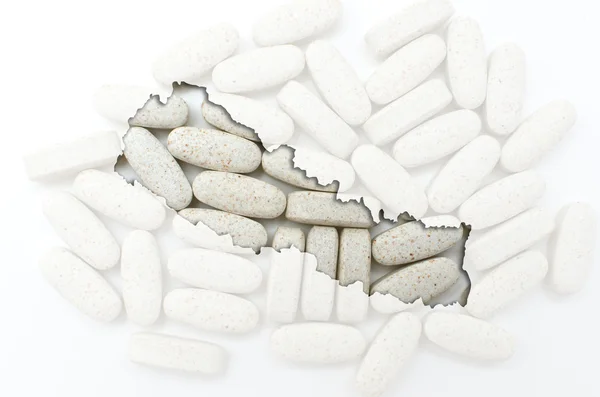 Outline map of nepal with pills in the background for health and — Stock Photo, Image