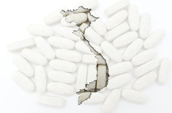 Outline map of vietnam with pills in the background for health a — Stock Photo, Image