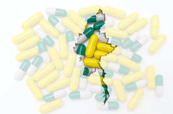 Outline map of myanmar with pills in the background for health a — Stock Photo, Image