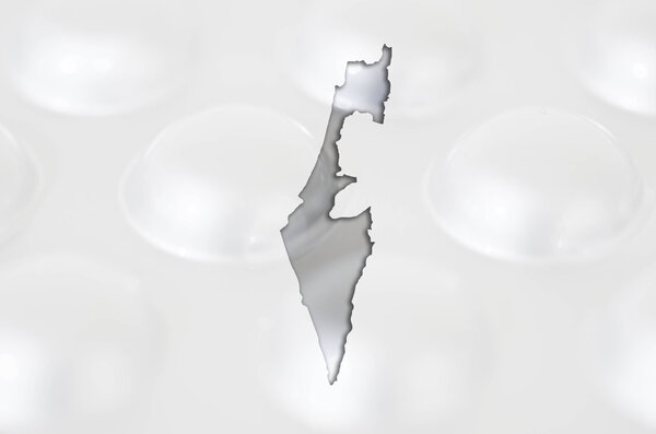 Outline map of israel with pills in the background for health an