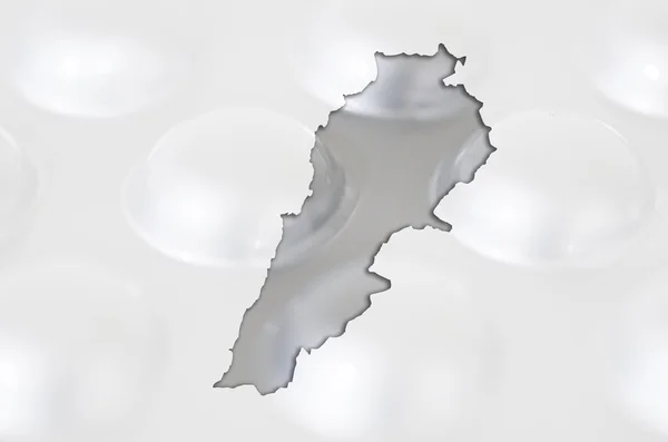 Outline map of lebanon with pills in the background for health a — Stock Photo, Image