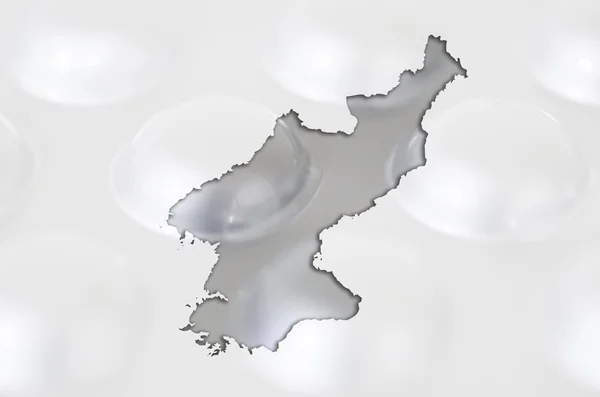 Mapa do contorno da Coréia do Norte com pílulas no fundo para curar — Fotografia de Stock