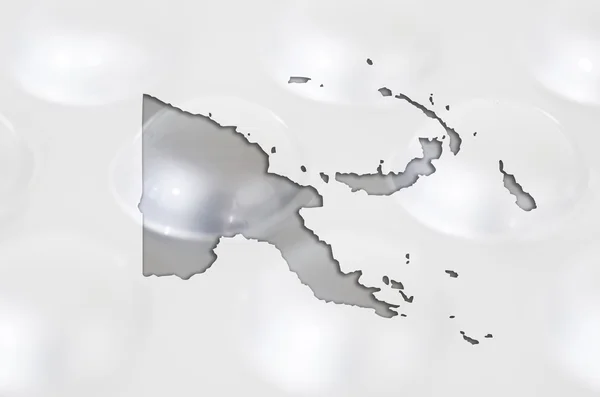 Контурна карта папуа нової морської зірки з таблетками на задньому плані для — стокове фото