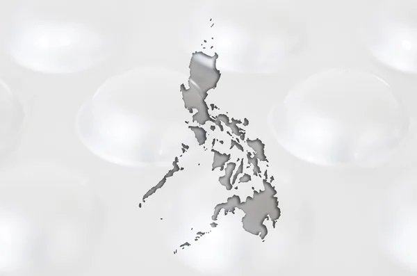 Mapa de contorno de filipinas com pílulas em segundo plano para curar — Fotografia de Stock