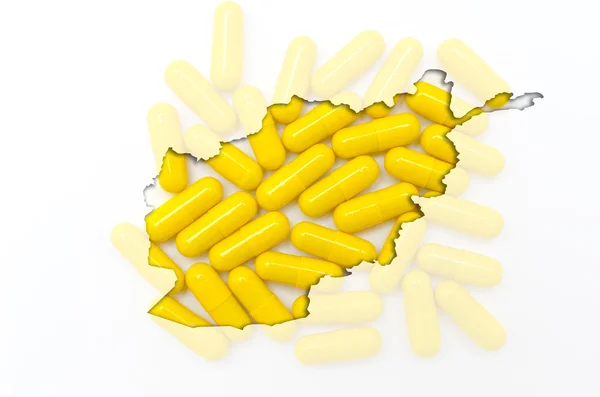 Outline map of afghanistan with pills in the background for heal — Stock Photo, Image