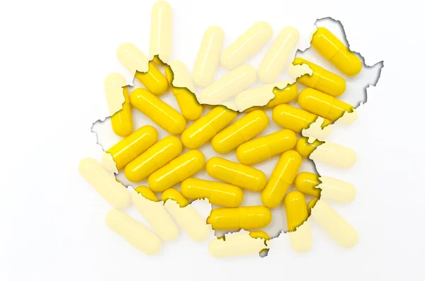 Mapa do contorno da China com pílulas em segundo plano para a saúde e — Fotografia de Stock