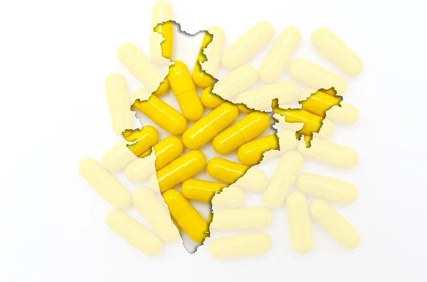 Περίγραμμα της Ινδίας με χάπια στο παρασκήνιο για την υγεία και — Φωτογραφία Αρχείου