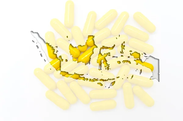 Übersichtskarte von Indonesien mit Pillen im Hintergrund für die Gesundheit — Stockfoto
