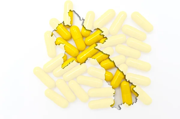 Outline map of laos with pills in the background for health and — Stock Photo, Image