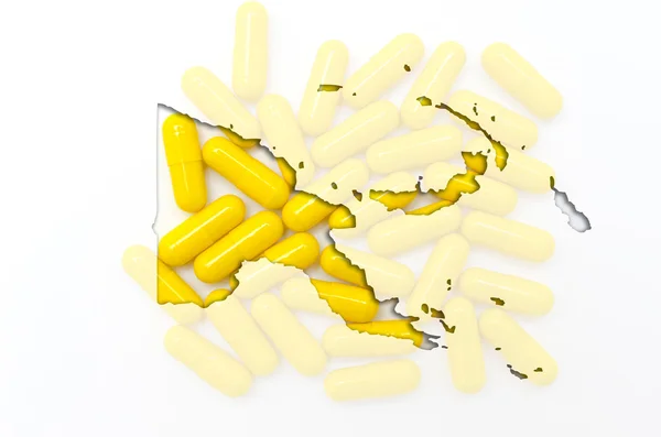 Outline map of papua new guinea with pills in the background for — Stock Photo, Image