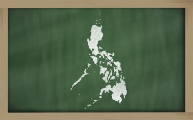 Outline map of philippines on blackboard clipart