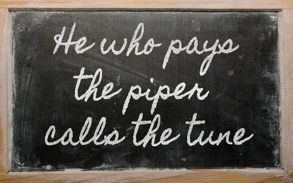 Expression - He who pays the piper calls the tune - written on — Stock Photo, Image