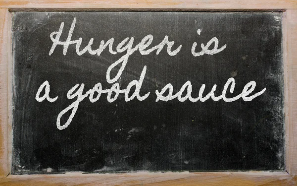 Ifade - açlık iyi bir sos - okul blackb üzerinde yazılı olduğunu. — Stok fotoğraf
