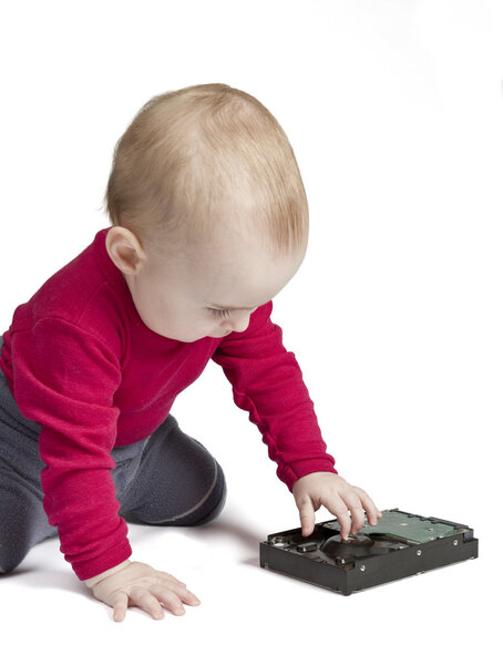 Young child in white background with hard drive