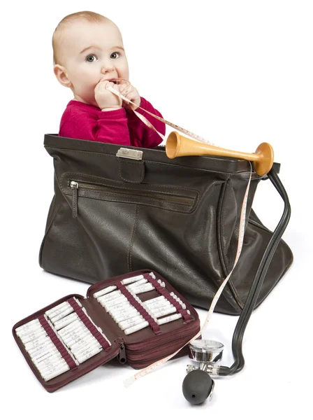 Young child sitting in midwifes case — Stock Photo, Image