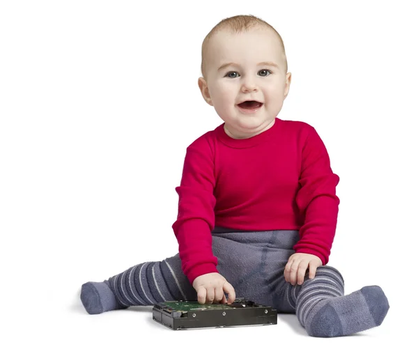 Malé dítě v bílém pozadí s pevným diskem — Stock fotografie