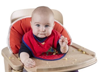 Toddler eating potatoes clipart