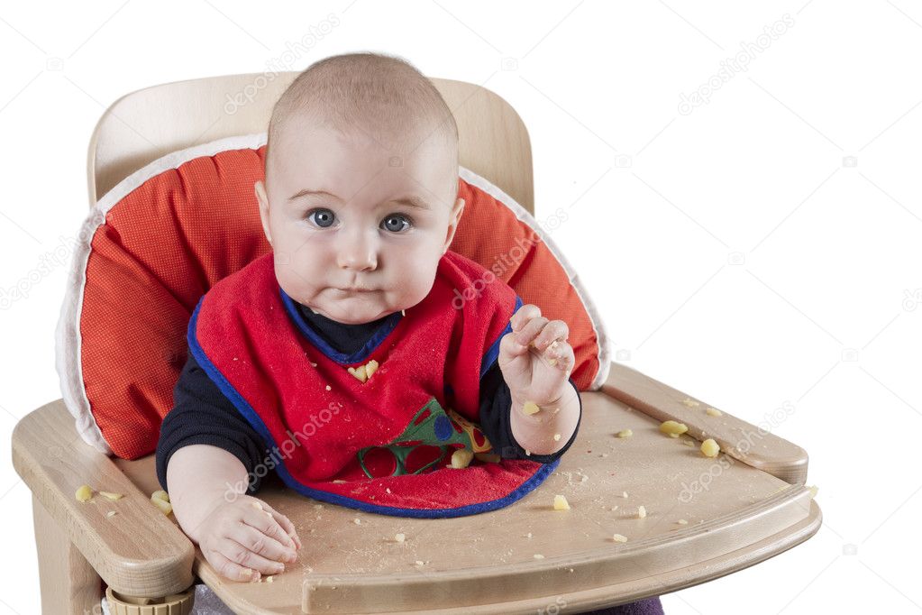 Toddler eating potatoes
