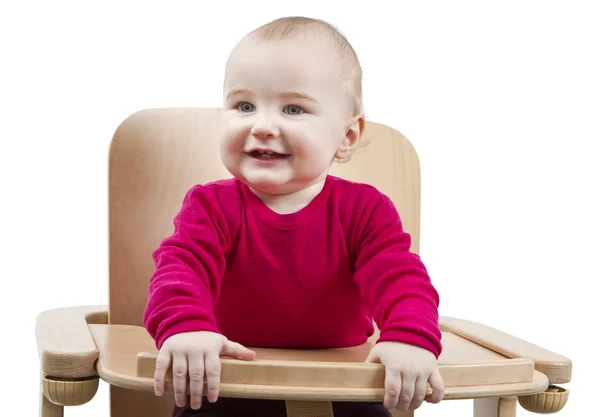 Jong kind zittend in hoge stoel — Stockfoto