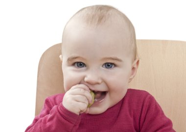 Child in red shirt eating clipart