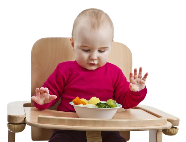 Маленька дитина їсть у високому кріслі — стокове фото