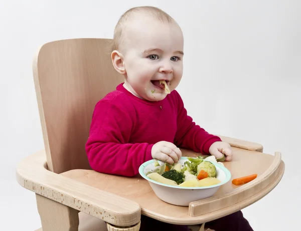 Malé dítě v sedačce — Stock fotografie