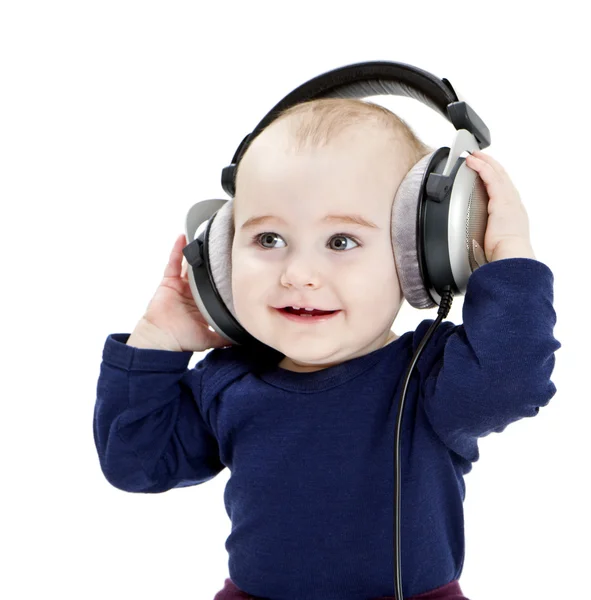 stock image Young child with ear-phones listening to music