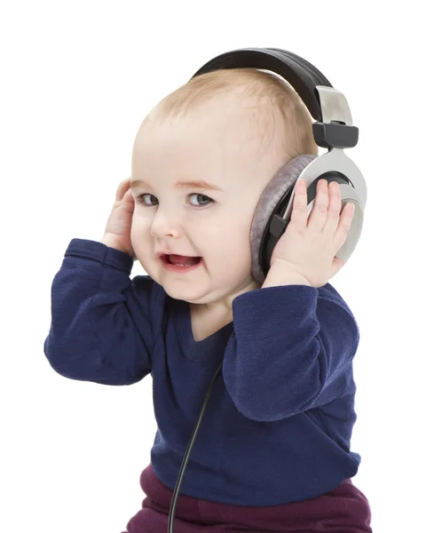 Kleines Kind mit Ohrhörern, das Musik hört — Stockfoto