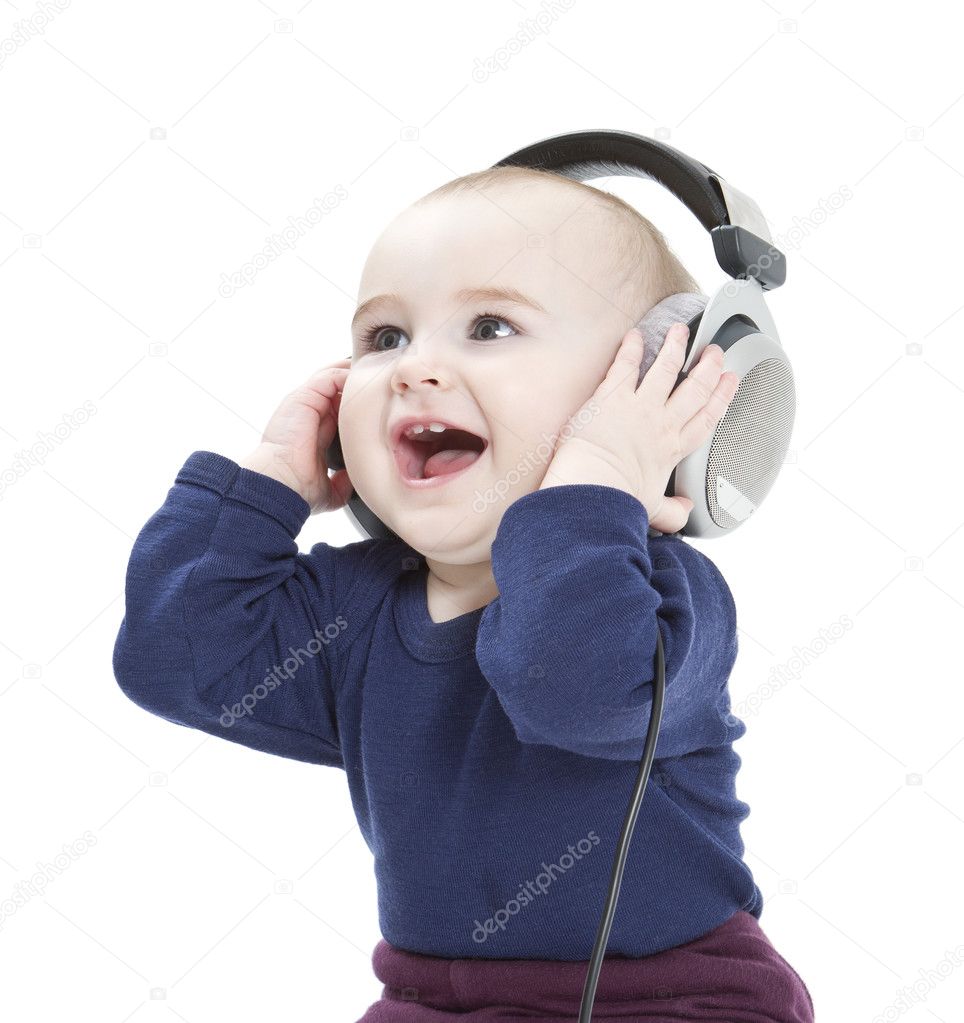 Young child with ear-phones listening to music