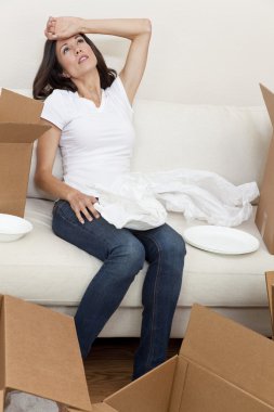 Single Woman Tired Unpacking Boxes Moving House clipart