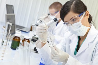 Chinese Female Woman Scientist With Test Tube In Laboratory clipart