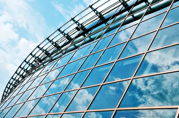 stock image Skyscrapers with clouds reflection