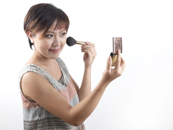 stock image Asian Chinese Woman putting on make up