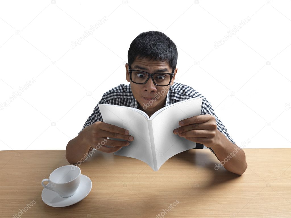 Indian Man reading book amazed