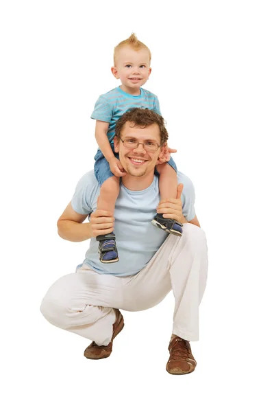 Szczęśliwy ojciec z małym synem na jego szyi Zdjęcia Stockowe bez tantiem