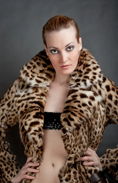 stock image Portrait of a beautiful young woman in a fur.